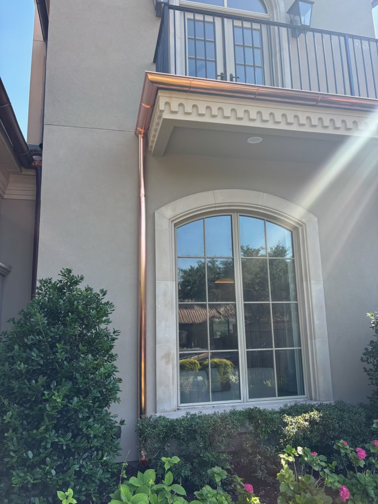 Copper gutter and downspout on a luxury home